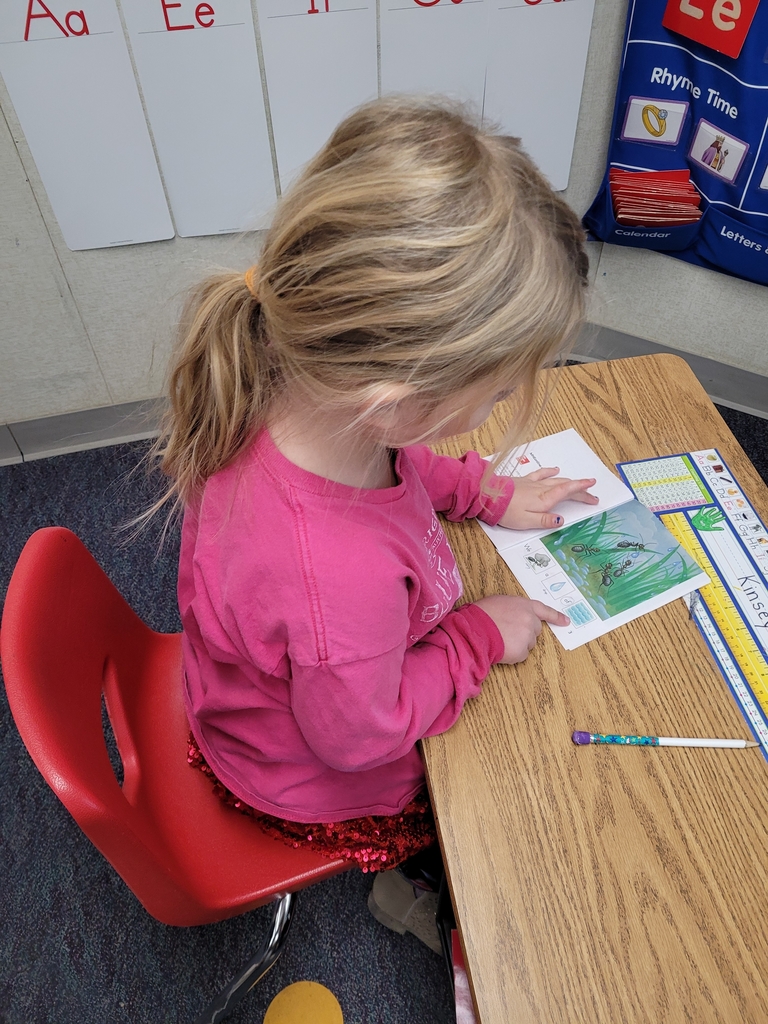 Kinsey reading her pre-decodable book. 
