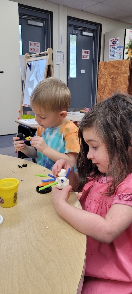 Gemma and Zander are putting straws in their turkeys.